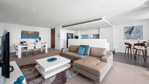 a living room with a couch and a table at Bayview 608 in Mandurah