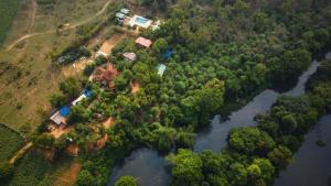 an aerial view of a house next to a river at Riverfront Resort Dandeli in Dandeli