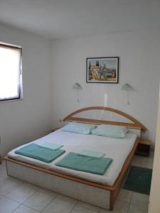 Llit o llits en una habitació de Apartment Kordić