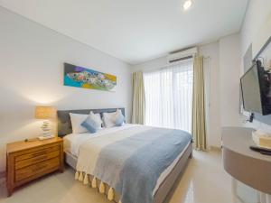 Postel nebo postele na pokoji v ubytování Hola Seminyak