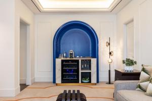a living room with a blue arch and a couch at The Westin Dubai Mina Seyahi Beach Resort and Waterpark in Dubai