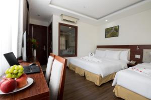 Letto o letti in una camera di Dao Ngoc Hotel Da Nang