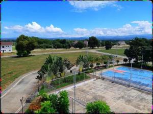 een uitzicht over een zwembad in een park bij Hanalei homes robinsons home laoag city ilocos norte in Bangued