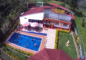 an aerial view of a house with a swimming pool at Casa Finca Kilometro 28 Bitaco in La Cumbre