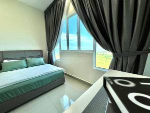 a bedroom with a bed and a large window at Melaka AmberCove Homely Seaview 2R2B in Malacca