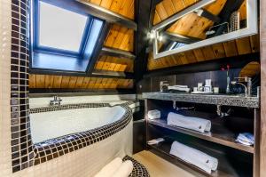 a bathroom with a tub and a sink at YIT Abentofail in Guadix +36 photos