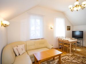 a living room with a couch and a table at Aparte Lux in Jūrmala