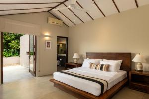 a bedroom with a large bed and a sliding glass door at Mount Havana in Kandy +89 photos