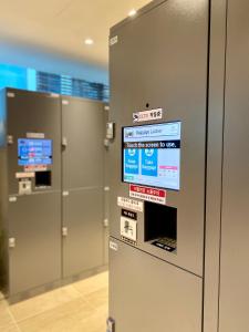 an elevator in an airport with signs on it at Hotel Prince Seoul in Seoul