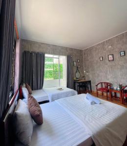 Postel nebo postele na pokoji v ubytování Amy 2 Hostel Hue