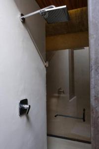 a bathroom with a shower stall with a fan at Viñedo Bodega 1881 in Santa Ana