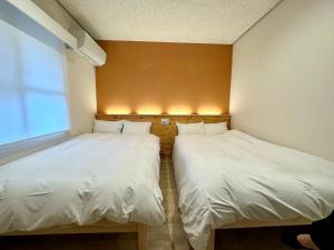 Hotel Ishigaki and Chikonkiya客房内的一张或多张床位
