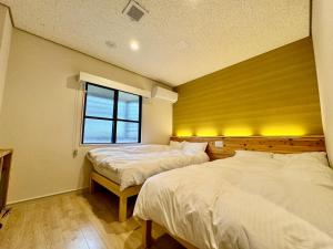 Hotel Ishigaki and Chikonkiya客房内的一张或多张床位