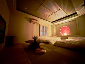 Hotel Ishigaki and Chikonkiya tesisinde bir odada yatak veya yataklar