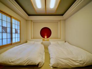 Hotel Ishigaki and Chikonkiya客房内的一张或多张床位