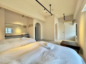 Hotel Ishigaki and Chikonkiya客房内的一张或多张床位