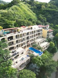 an aerial view of a large building with a swimming pool at Oceanview Rancho with Two bedroom & Two baths in Coco