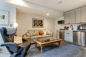 a living room with a couch and a table at Brand new two room apartment building on a park in Denver