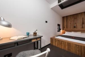 a bedroom with a bed and a desk with a chair at Villa Gordan - Happy Rentals in Dragove +21 photos