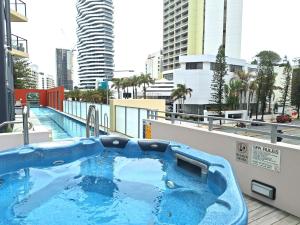 a hot tub on the roof of a building at Broadbeach on the park 2-Bedroom in Gold Coast