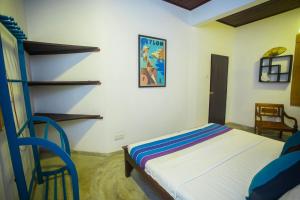 Postel nebo postele na pokoji v ubytování Villa Trendy Unawatuna