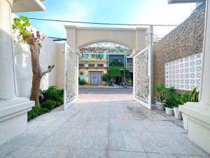 an entrance to a building with an archway at Milan Homestay - Milanesa Hotel and Apartment in Vung Tau
