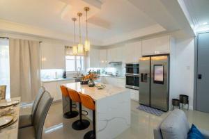 a kitchen with a island in the middle of a room at The Luxurious Château in Kingston