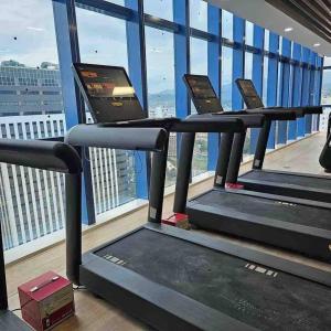 a row of treadmills in a gym at 38 Park Avenue Condominium Cebu IT Park - Unit Freyja in Cebu City