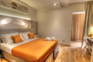 Postel nebo postele na pokoji v ubytování Hotel Colorado