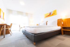 Postel nebo postele na pokoji v ubytování Hotel Darstein