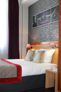 Lova arba lovos apgyvendinimo įstaigoje Hotel du Chemin Vert