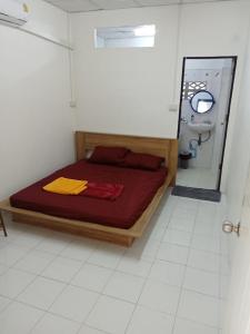 Postel nebo postele na pokoji v ubytování Tiki Tribe Bar & Hostel