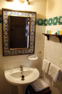 a bathroom with a sink and a mirror at Villa Turística de Grazalema in Grazalema