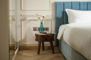 Letto o letti in una camera di Palazzo Castagna Boutique Hotel