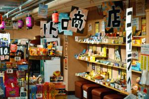 a store filled with lots of toys on shelves at Takasago Onsen in Asahikawa