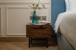 Letto o letti in una camera di Palazzo Castagna Boutique Hotel