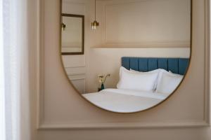 Letto o letti in una camera di Palazzo Castagna Boutique Hotel