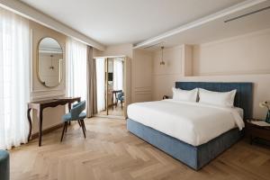 Letto o letti in una camera di Palazzo Castagna Boutique Hotel