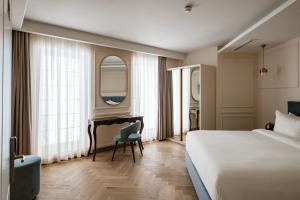 Letto o letti in una camera di Palazzo Castagna Boutique Hotel