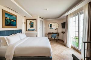 Letto o letti in una camera di Palazzo Castagna Boutique Hotel