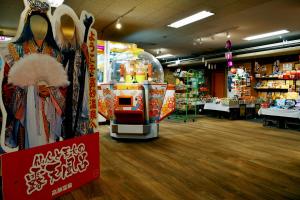 a store with a costume shop with a claw machine at Takasago Onsen in Asahikawa