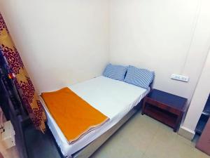 Jayalaxmi Comforts客房内的一张或多张床位