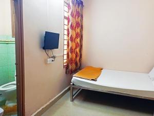 Jayalaxmi Comforts客房内的一张或多张床位
