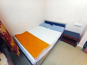 Jayalaxmi Comforts客房内的一张或多张床位