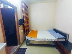 Jayalaxmi Comforts客房内的一张或多张床位