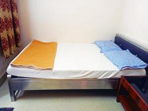 Jayalaxmi Comforts客房内的一张或多张床位