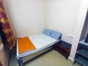 Jayalaxmi Comforts客房内的一张或多张床位