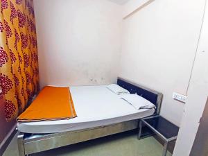 Jayalaxmi Comforts客房内的一张或多张床位