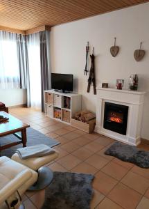 Telewizja i/lub zestaw kina domowego w obiekcie Apartment Gerlitzen Garden