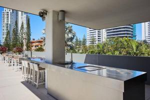 a bar on a balcony with a view of the city at Convenient Located 2 Bedroom Apartment Next to Casino in Gold Coast